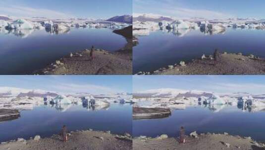 一名妇女站在北极冰川泻湖岸边高清在线视频素材下载