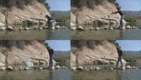 男子正在加利福尼亚州奥贾伊文图拉河保护区清除鱼栏上的石头高清在线视频素材下载