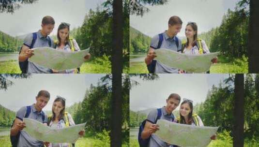 年轻夫妇在风景如画的地方看地图高清在线视频素材下载