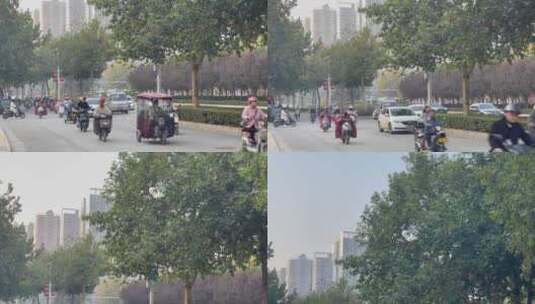 骑电动车带头盔人流车流上摇城市高清在线视频素材下载