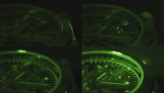 绿光照射中的手表指针转动高清在线视频素材下载
