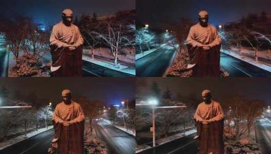 航拍鉴真路扬州雪景夜景鉴真像飘雪高清在线视频素材下载