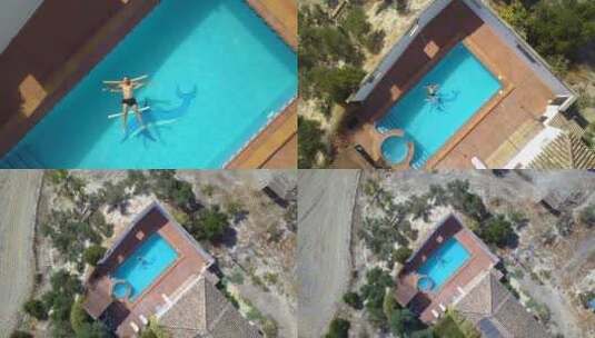 空中升空，一名男子冷冷地漂浮在游泳池上。高清在线视频素材下载