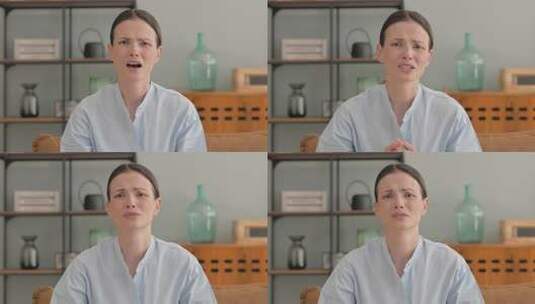 震惊的年轻女子在家敬畏的肖像高清在线视频素材下载