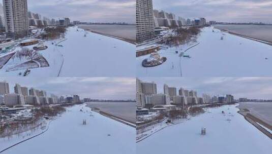 雪后城市的海边及建筑群鸟瞰全景高清在线视频素材下载