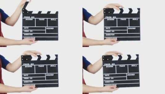 女孩使用电影制作拍板高清在线视频素材下载
