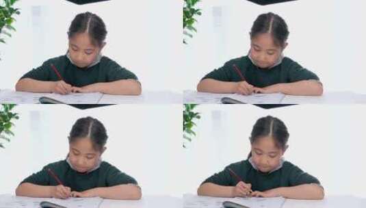 东方女孩一个人在学习写作业高清在线视频素材下载