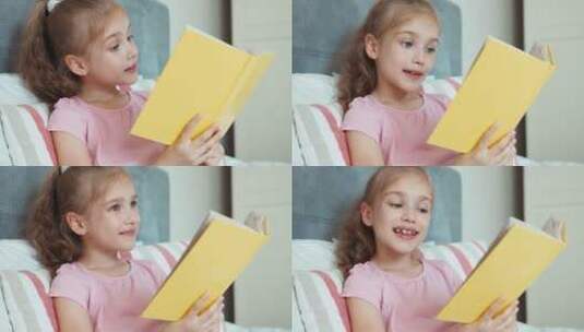 女孩靠在床上读书高清在线视频素材下载