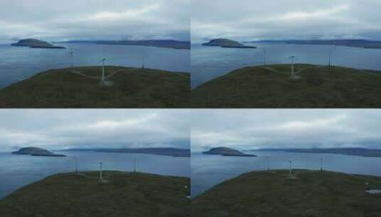 航拍海岸边风力发电机高清在线视频素材下载