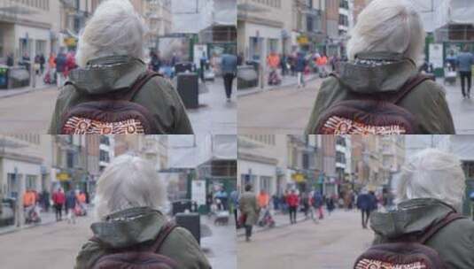 老妇在街道上行走高清在线视频素材下载