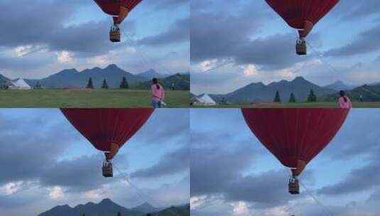 草地热气球飞行4K实拍视频高清在线视频素材下载