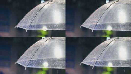 下雨的夜晚，雨水从透明雨伞上滑落高清在线视频素材下载