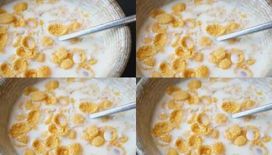 玉米片与牛奶混合在碗里高清在线视频素材下载