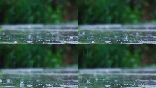下雨天雨水滴落到地面产生涟漪慢动作高清在线视频素材下载