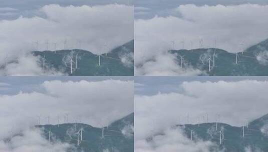 山顶风能发电风车和环绕的云海航拍高清在线视频素材下载