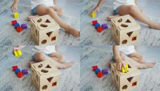可爱的高加索小女孩在家里玩生态木制玩具高清在线视频素材下载