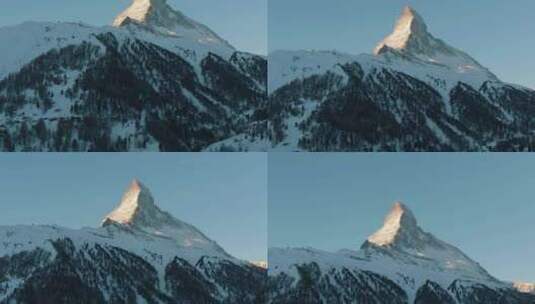 瑞士阿尔卑斯山冬季清晨的马特宏山和森林高清在线视频素材下载