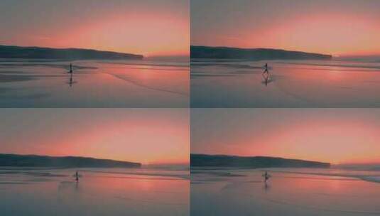 夕阳下女孩拿着冲浪板跑向大海高清在线视频素材下载