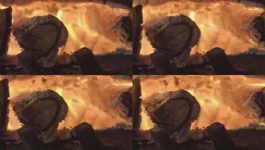 壁炉里燃烧发光的木头，特写延时拍摄高清在线视频素材下载