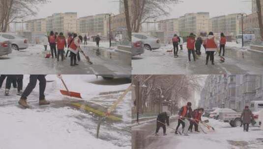 志愿者在马路上铲雪高清在线视频素材下载