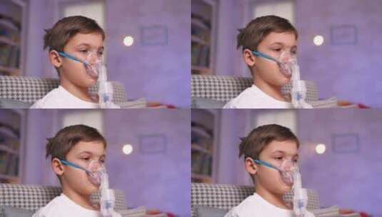 喷雾器吸入器口罩中的肖像男孩以蒸汽的形式高清在线视频素材下载