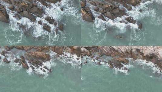 俯拍海岸礁石海浪拍打岩石海水海边浪花潮水高清在线视频素材下载