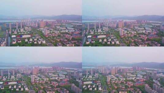 日出晨曦中的杭州滨江城市建筑风景航拍高清在线视频素材下载