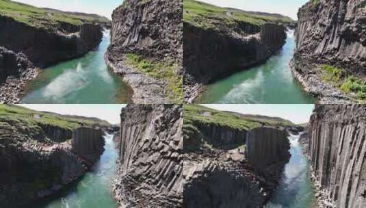 晴天，冰岛东部斯图拉吉尔峡谷的玄武岩柱——无人机拍摄高清在线视频素材下载