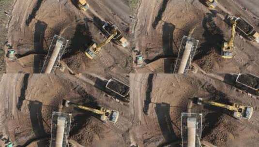 挖掘机装载泥土的建筑自卸卡车高清在线视频素材下载