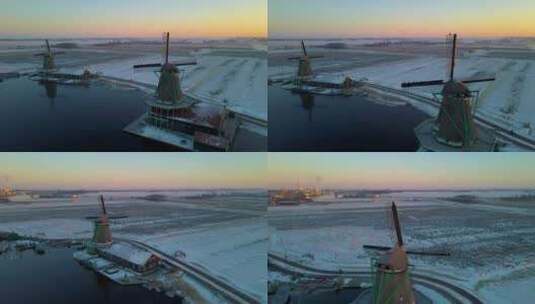 Zaanse Schans风车村的木制风力磨坊在冬季与雪景雪高清在线视频素材下载