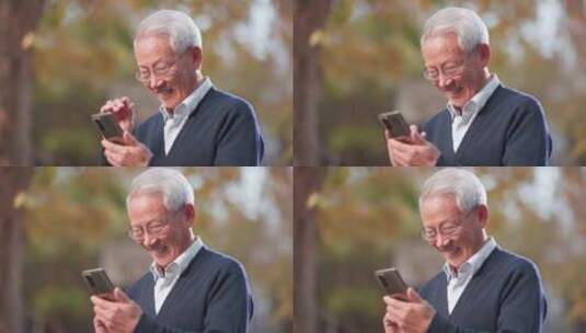 4K老人看手机微笑高清在线视频素材下载