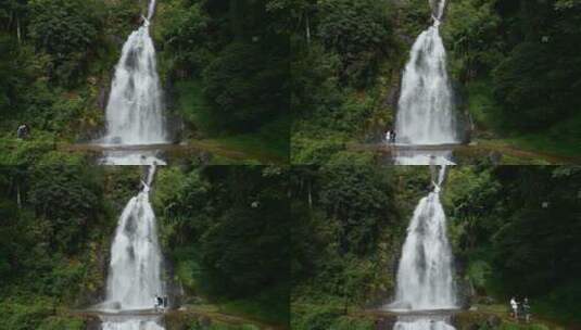 大瀑布下走过游客高清在线视频素材下载