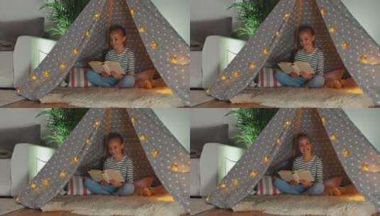 坐在帐篷里的读书女孩高清在线视频素材下载