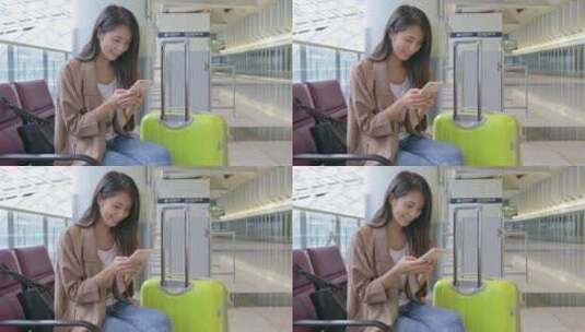 妇女在机场使用手机高清在线视频素材下载