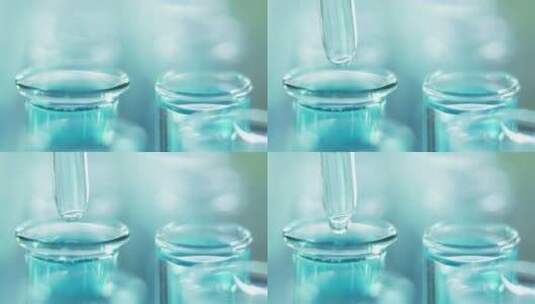 把水滴在实验室的试管上高清在线视频素材下载