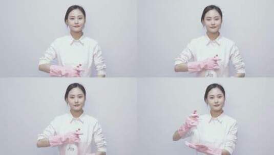 年轻保洁女性形象 白色背景下带着手套高清在线视频素材下载