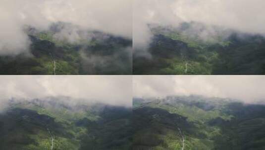 航拍穿过云雾看见群山高清在线视频素材下载