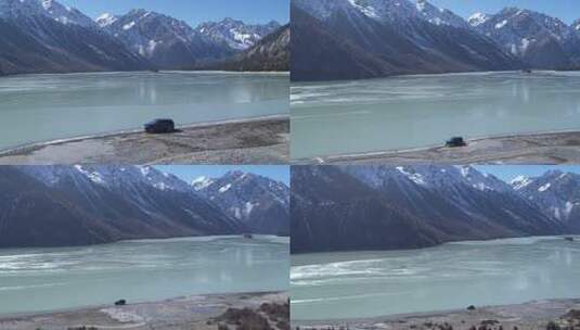 西藏然乌湖雪山车辆行驶高山湖泊航拍高清在线视频素材下载