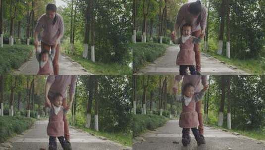小女孩在公园和妈妈一起玩耍牵手散步高清在线视频素材下载