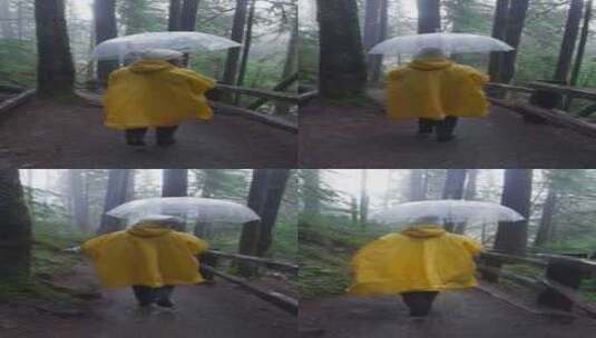 穿着雨衣的年轻女子在雨伞下享受森林雨高清在线视频素材下载