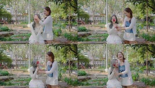 两位年轻的亚洲恋人用玫瑰带来由衷的惊喜。高清在线视频素材下载