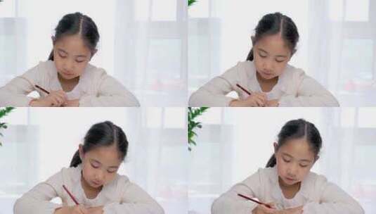 东方女孩一个人在学习写作业高清在线视频素材下载