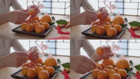 坐在窗前剥橘子的女性手部特写高清在线视频素材下载