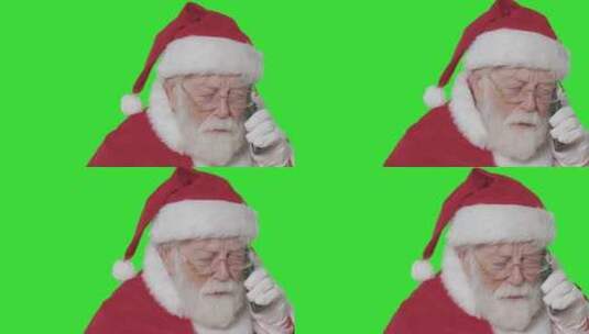 绿色背景下圣诞老人在打电话高清在线视频素材下载