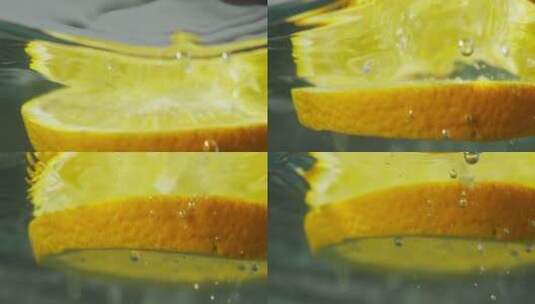 柑橘切片在水中漂浮高清在线视频素材下载