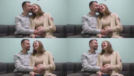 孕妇和她的丈夫坐在沙发上聊天高清在线视频素材下载