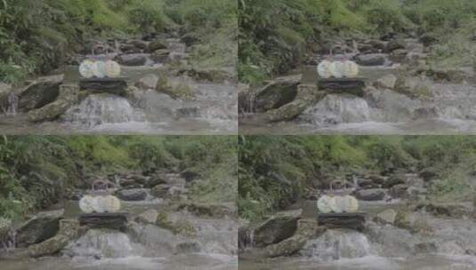 茶叶包装在溪流里高清在线视频素材下载