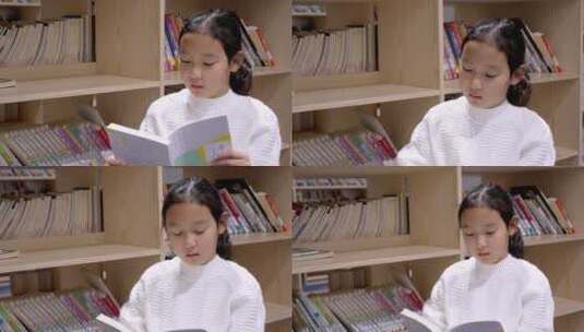 4K升格实拍坐在图书馆书架旁看书的女孩高清在线视频素材下载