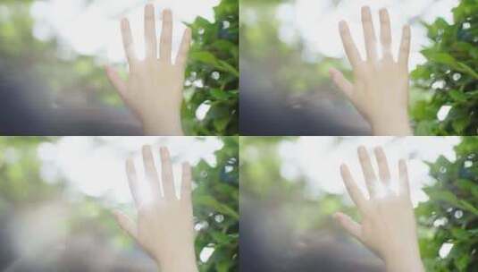 女孩伸手触摸阳光 阳光穿过指缝高清在线视频素材下载