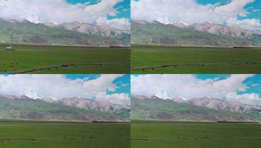 青藏高原雪山草原青藏铁路行驶的列车航拍高清在线视频素材下载